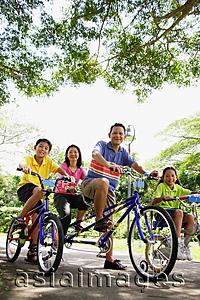Asia Images Group - Family, on bicycles, portrait, low angle view