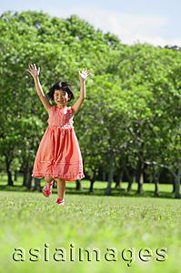 Asia Images Group - Girl running towards camera, arms outstretched, smiling