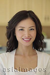 Asia Images Group - Head shot of young woman smiling
