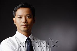 AsiaPix - Young executive, looking at camera, portrait