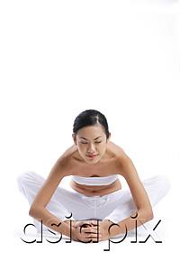 AsiaPix - Woman sitting on floor, stretching