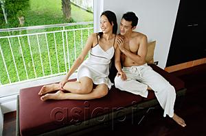 AsiaPix - Couple sitting on daybed next to window