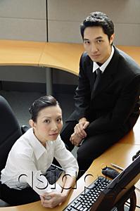 AsiaPix - Executives in office cubicle, looking at camera