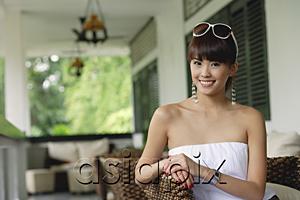 AsiaPix - Young woman in white tube top, smiling at camera