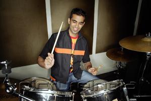PictureIndia - Young man playing drums